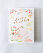 Greeting card with 'Happy Birthday' text and illustrations on a white background